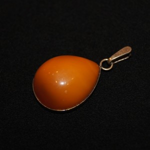 Vintage golden pendant with amber